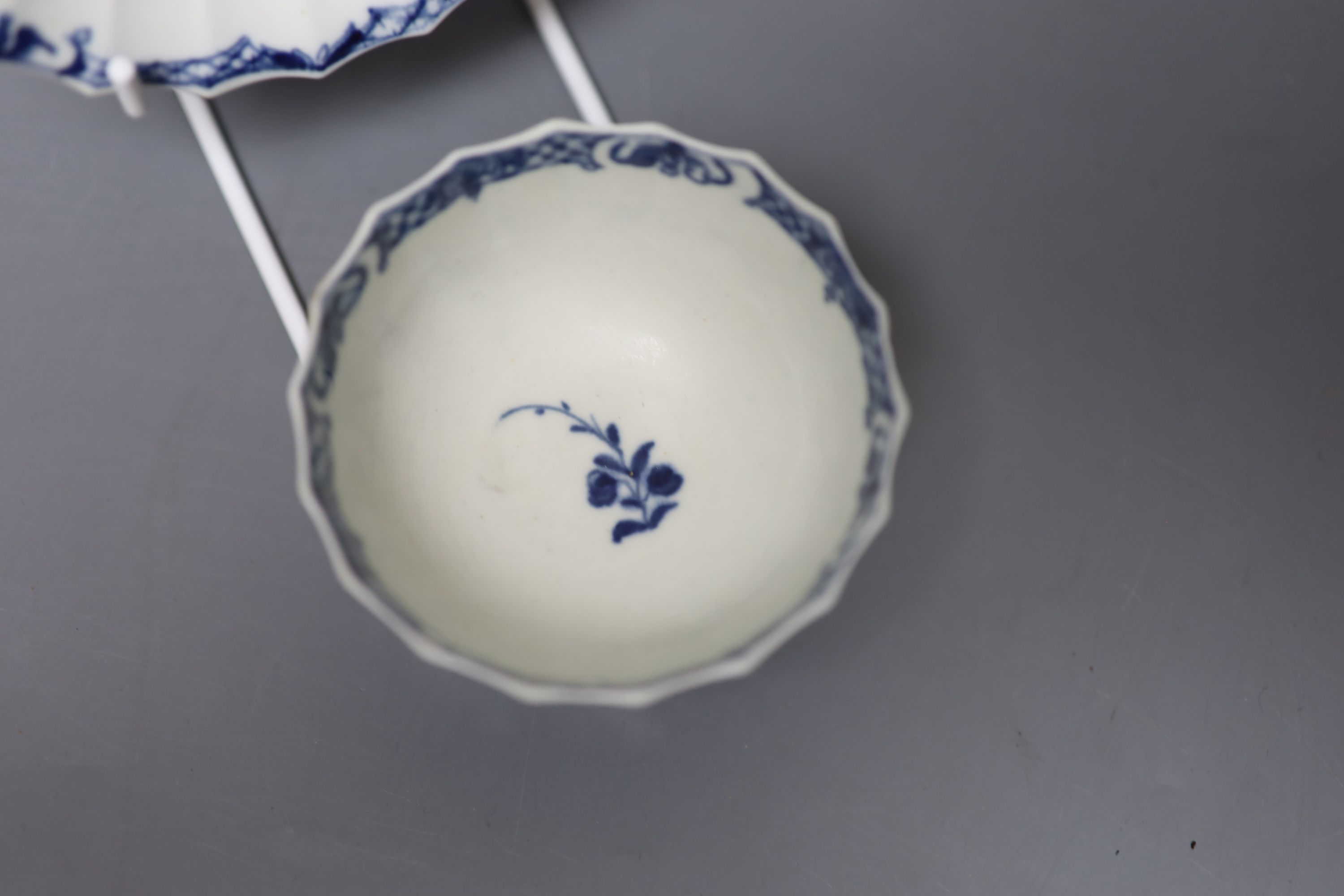 An 18th century Worcester tea bowl and saucer painted with the Hollow Rock Lily pattern, crescent marks